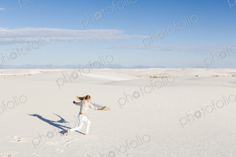 13 year old girl dancing in the dunes, White Sands Nat'l Monument, NM