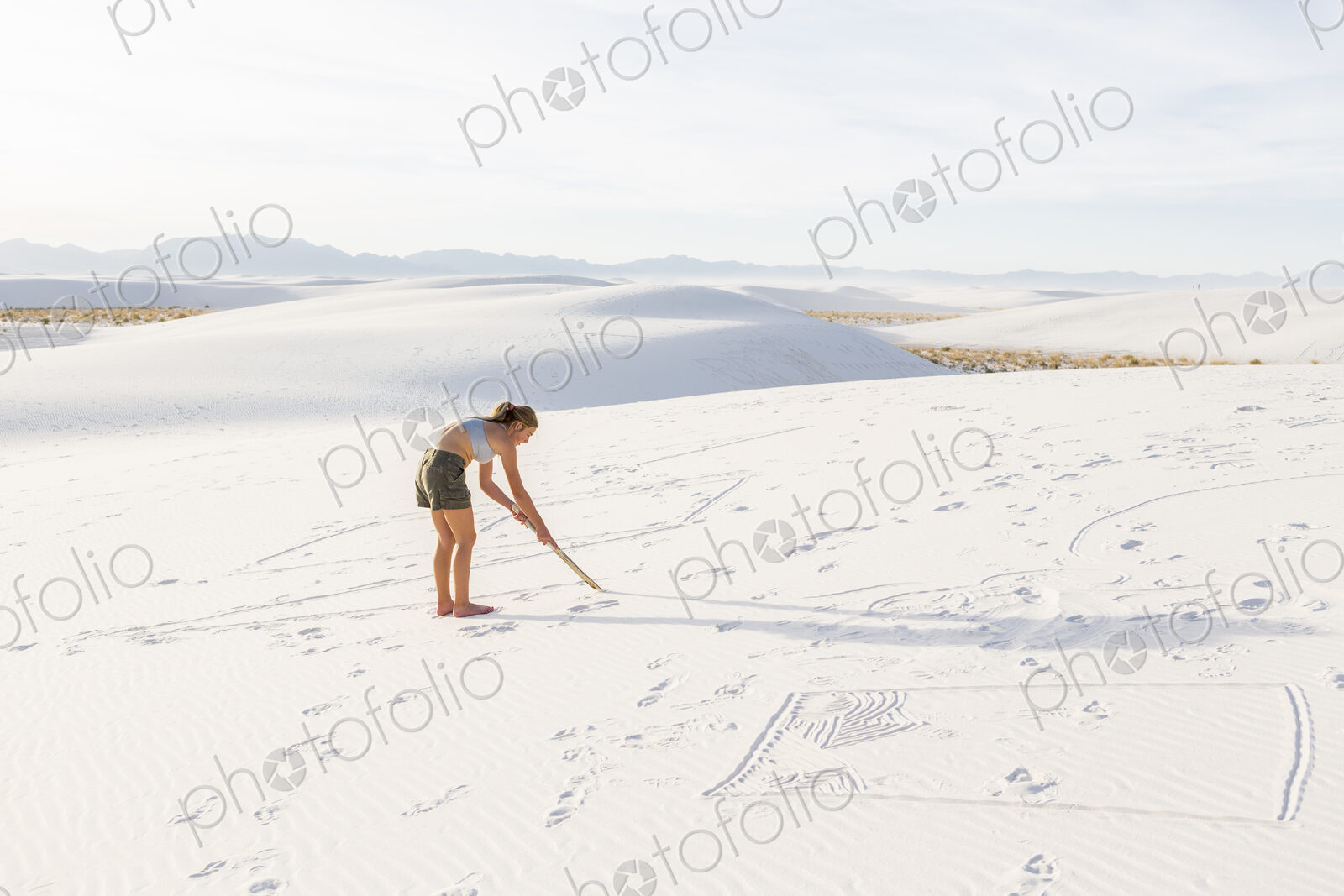 13 year old girl drawing in the sand, White Sands Nat’l Monument, NM