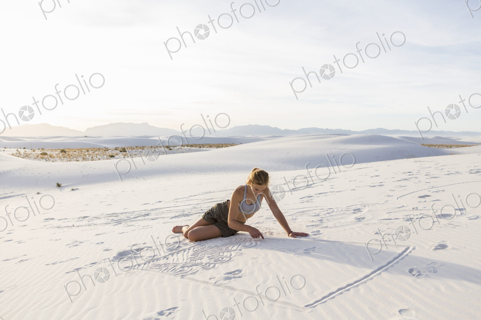 13 year old girl drawing in the sand, White Sands Nat’l Monument, NM