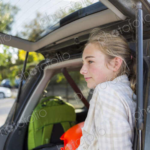 13 year old girl in back of SUV with luggage 13 year old girl in back of SUV with luggage