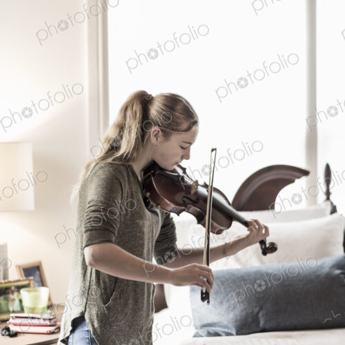13 year old girl playing violin in bedroom 13 year old girl playing violin in bedroom