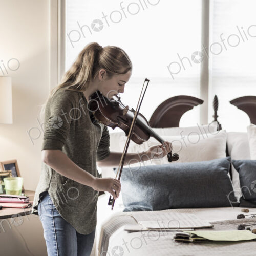 13 year old girl playing violin in bedroom 13 year old girl playing violin in bedroom