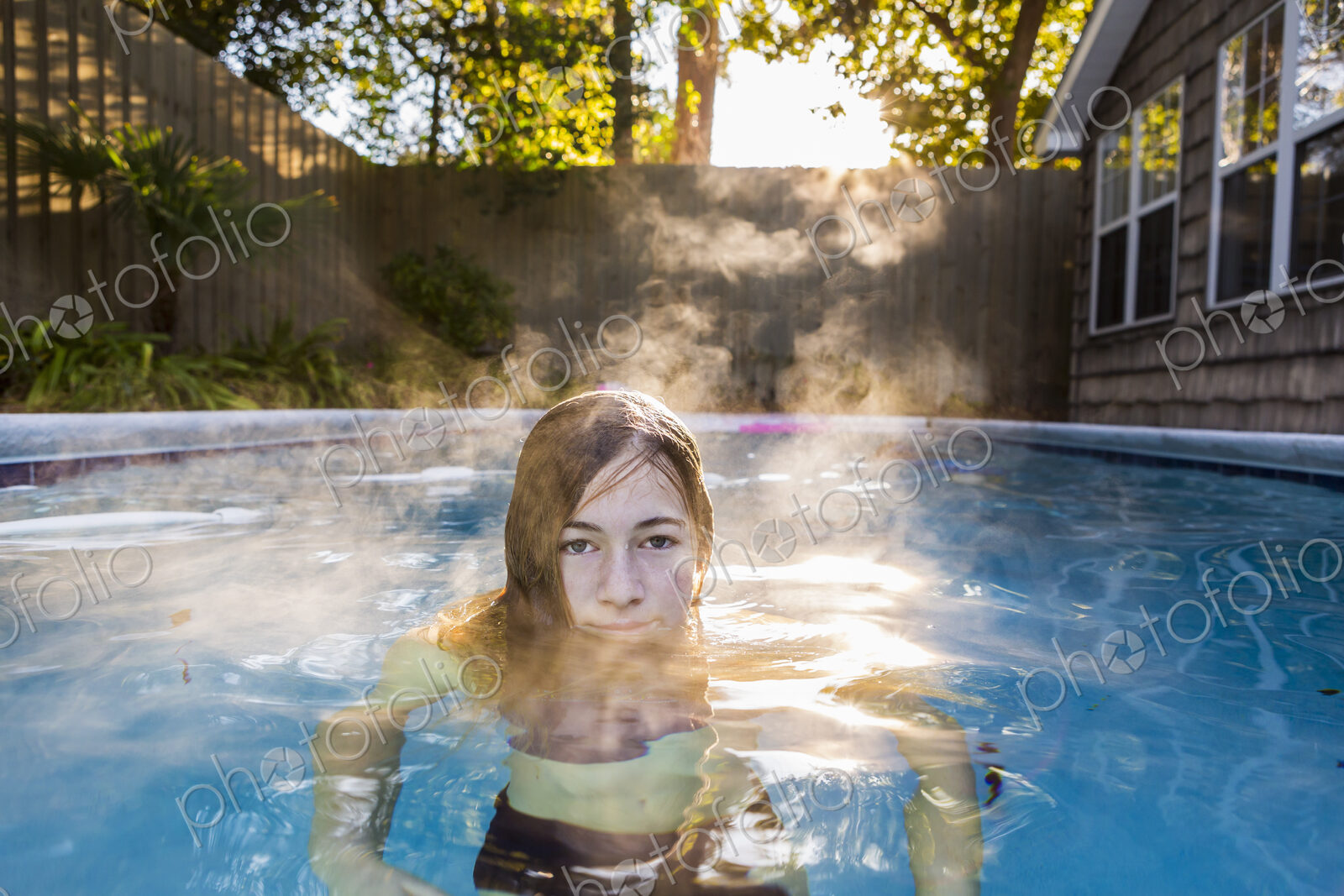 13 year old girl swimming in a pool