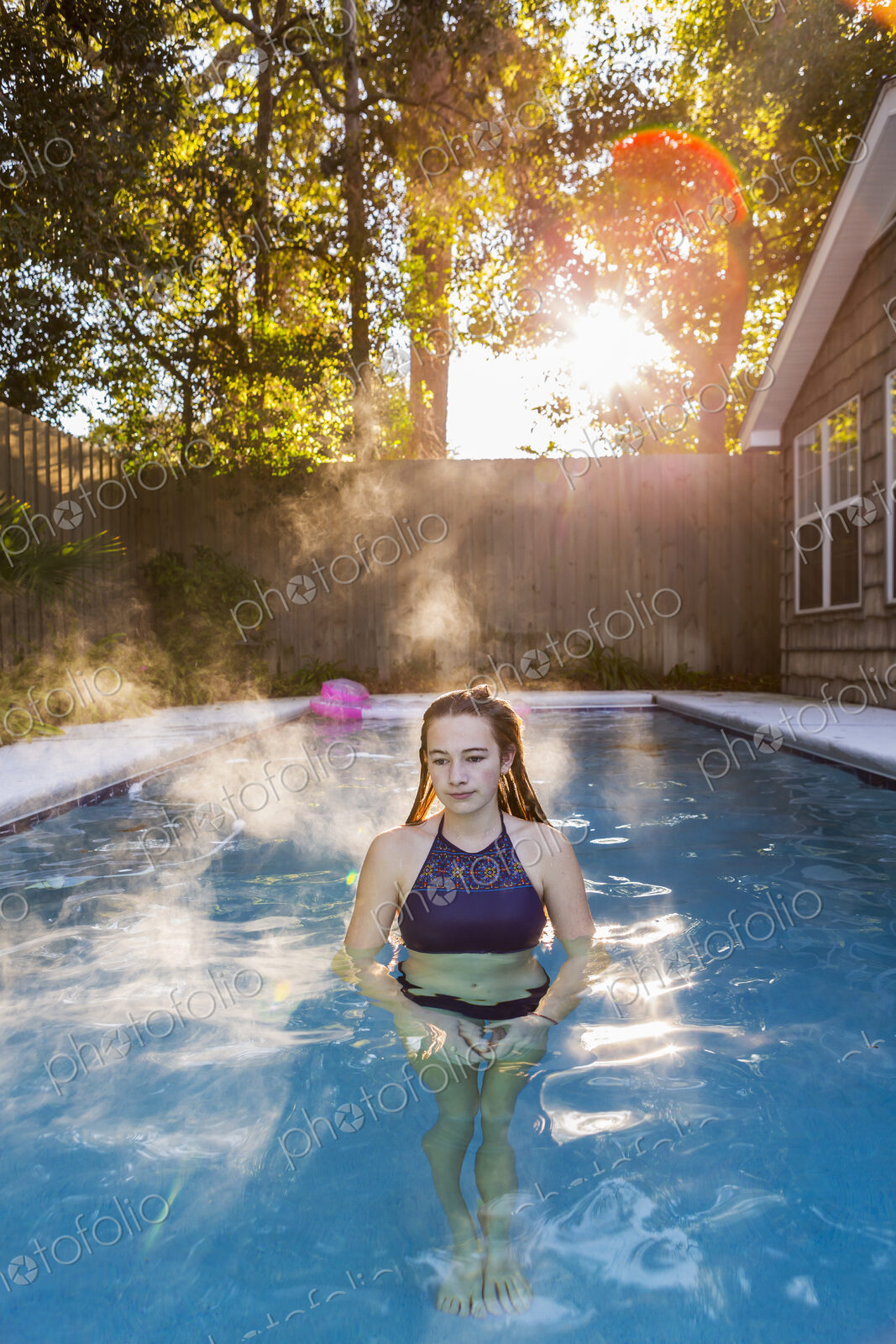 13 year old girl swimming in a pool