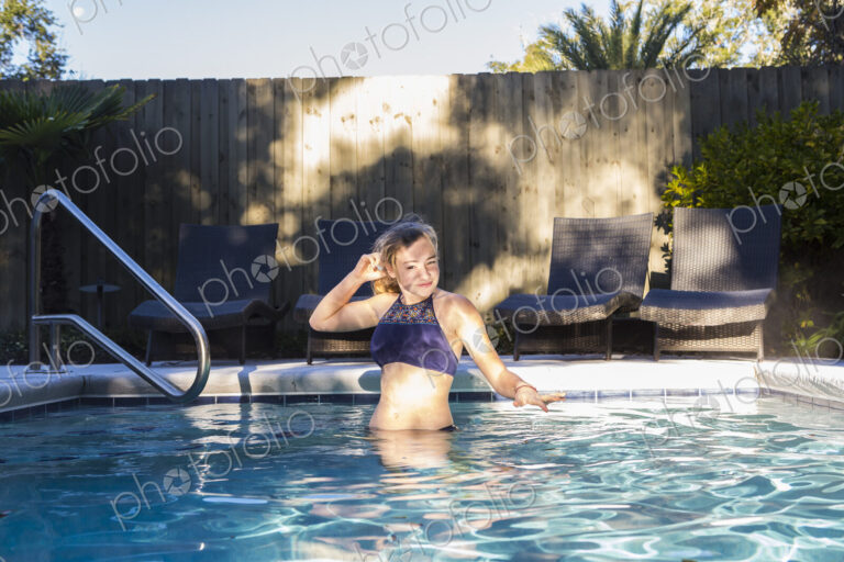 13 year old girl swimming in a pool