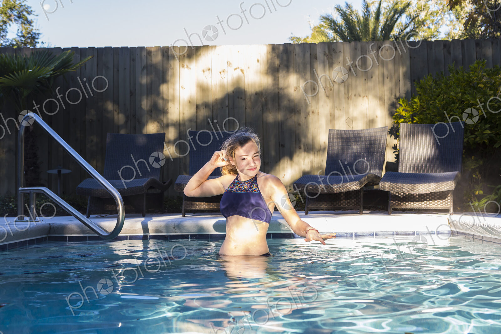 13 year old girl swimming in a pool