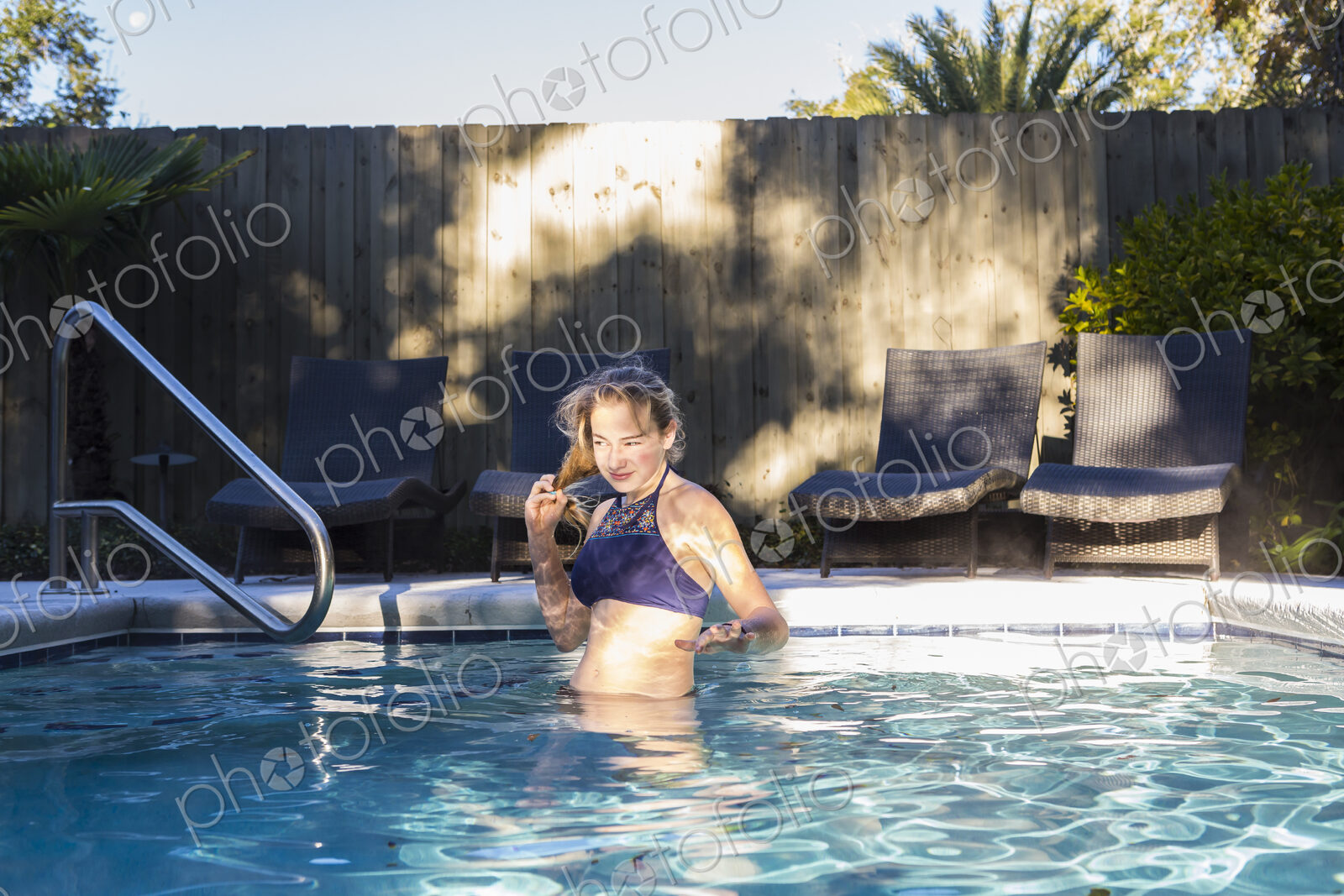 13 year old girl swimming in a pool