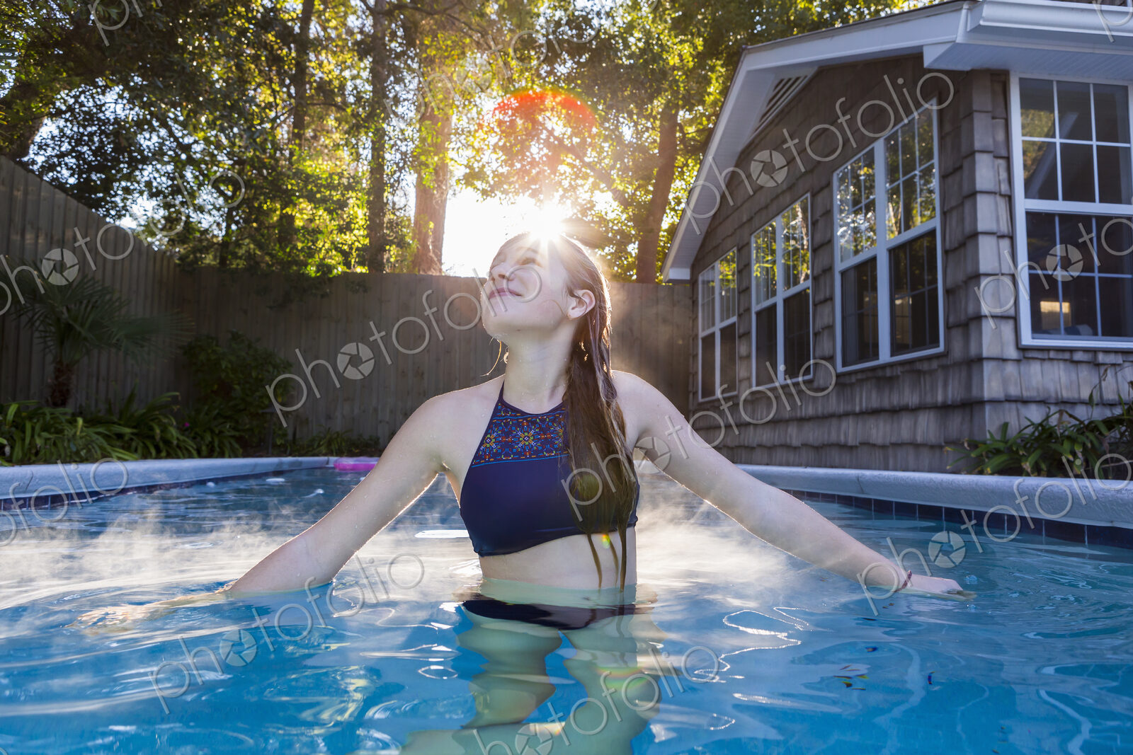 13 year old girl swimming in a pool