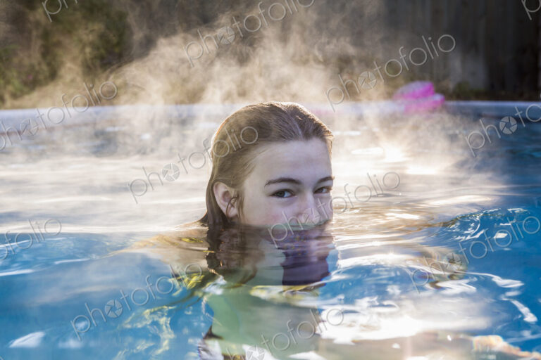 13 year old girl swimming in a pool