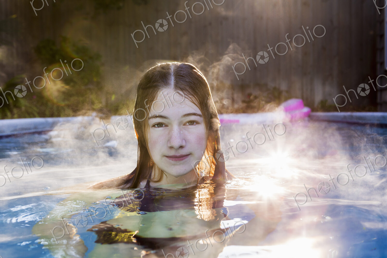 13 year old girl swimming in a pool