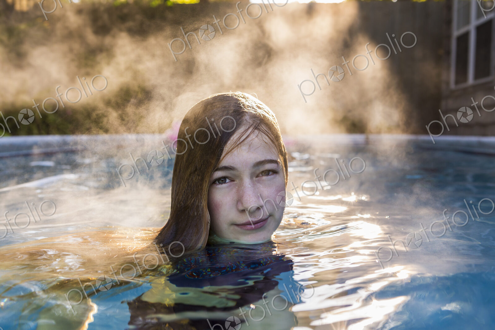 13 year old girl swimming in a pool