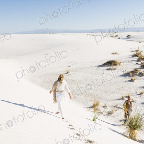 13 year old girl walking across sand dunes leaving footprints 13 year old girl walking across sand dunes leaving footprints
