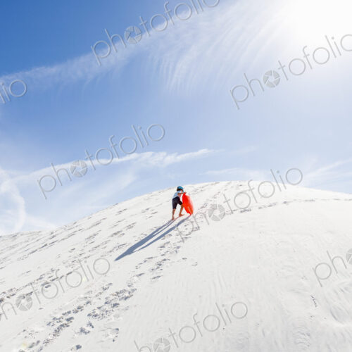 6 year old boy climbing sand dune 6 year old boy climbing sand dune