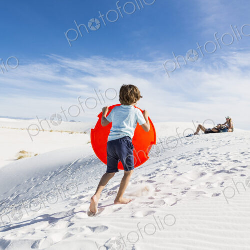 6 year old boy climbing sand dune 6 year old boy climbing sand dune