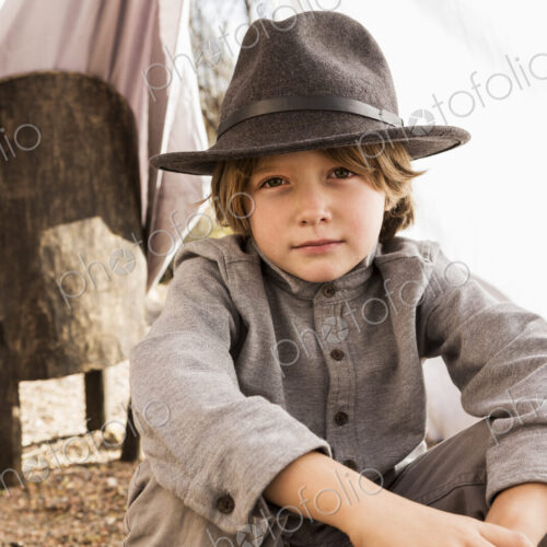 6 year old boy playing in an outdoor tent made of sheets 6 year old boy playing in an outdoor tent made of sheets