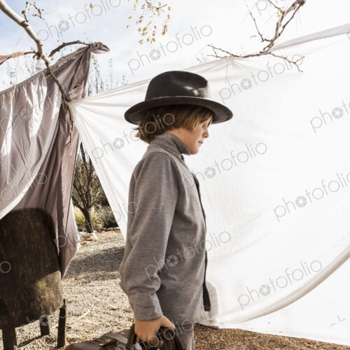 6 year old boy playing in an outdoor tent made of sheets 6 year old boy playing in an outdoor tent made of sheets