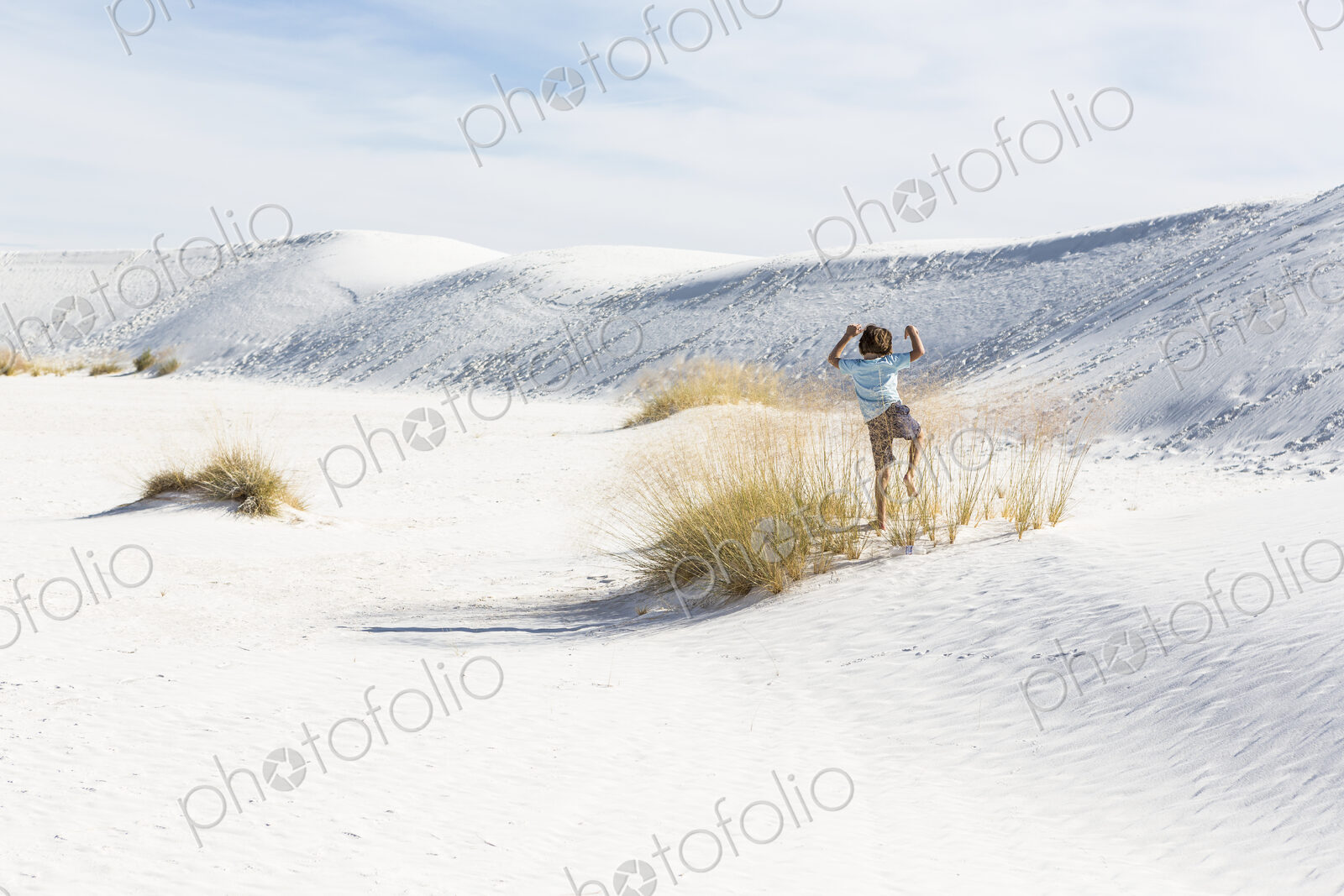 6 year old boy playing in sand dunes, White Sands Nat’l Monument, NM