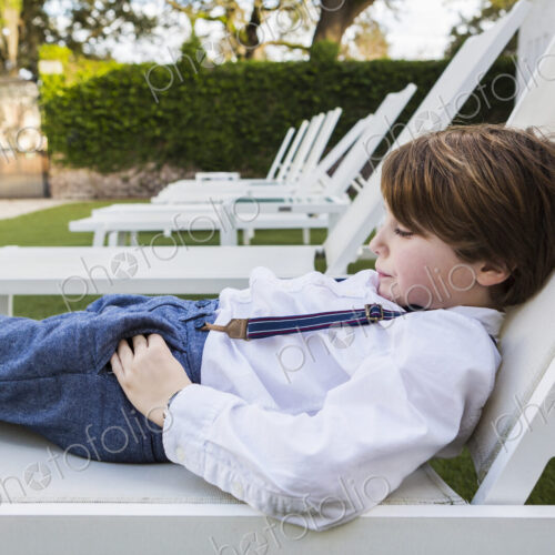 6 year old boy reclining on lawn chair