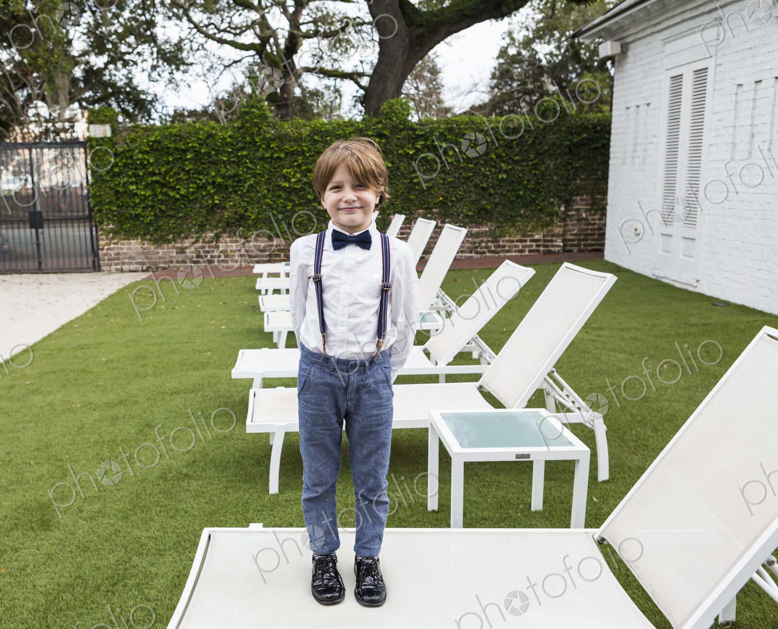 6 year old boy standing on lawn chair