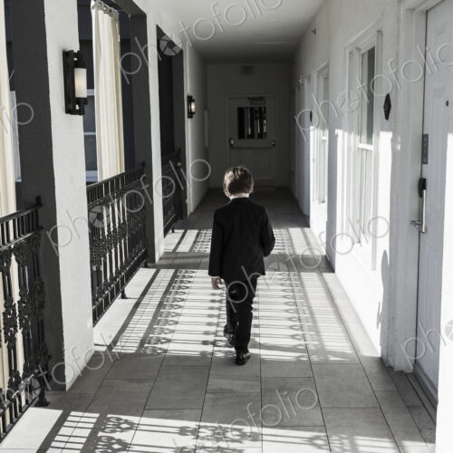 6 year old boy walking down corridor 6 year old boy walking down corridor