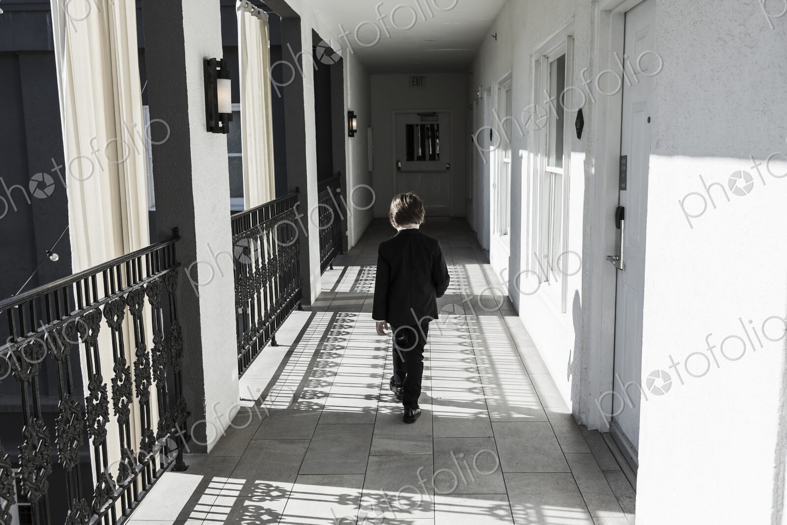 6 year old boy walking down corridor