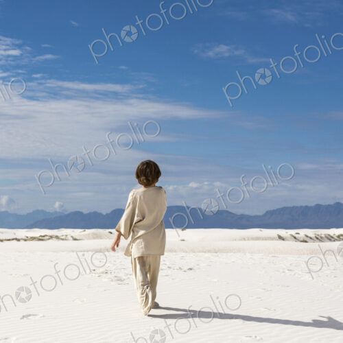 6 year old boy walking in sand dnes. 6 year old boy walking in sand dnes.