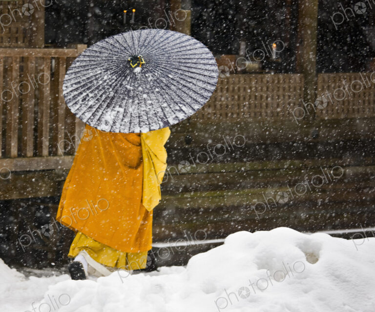 A Bhuddist monk walks through a snow flurry in Koyasan, a centre for Shingon Esoteric…