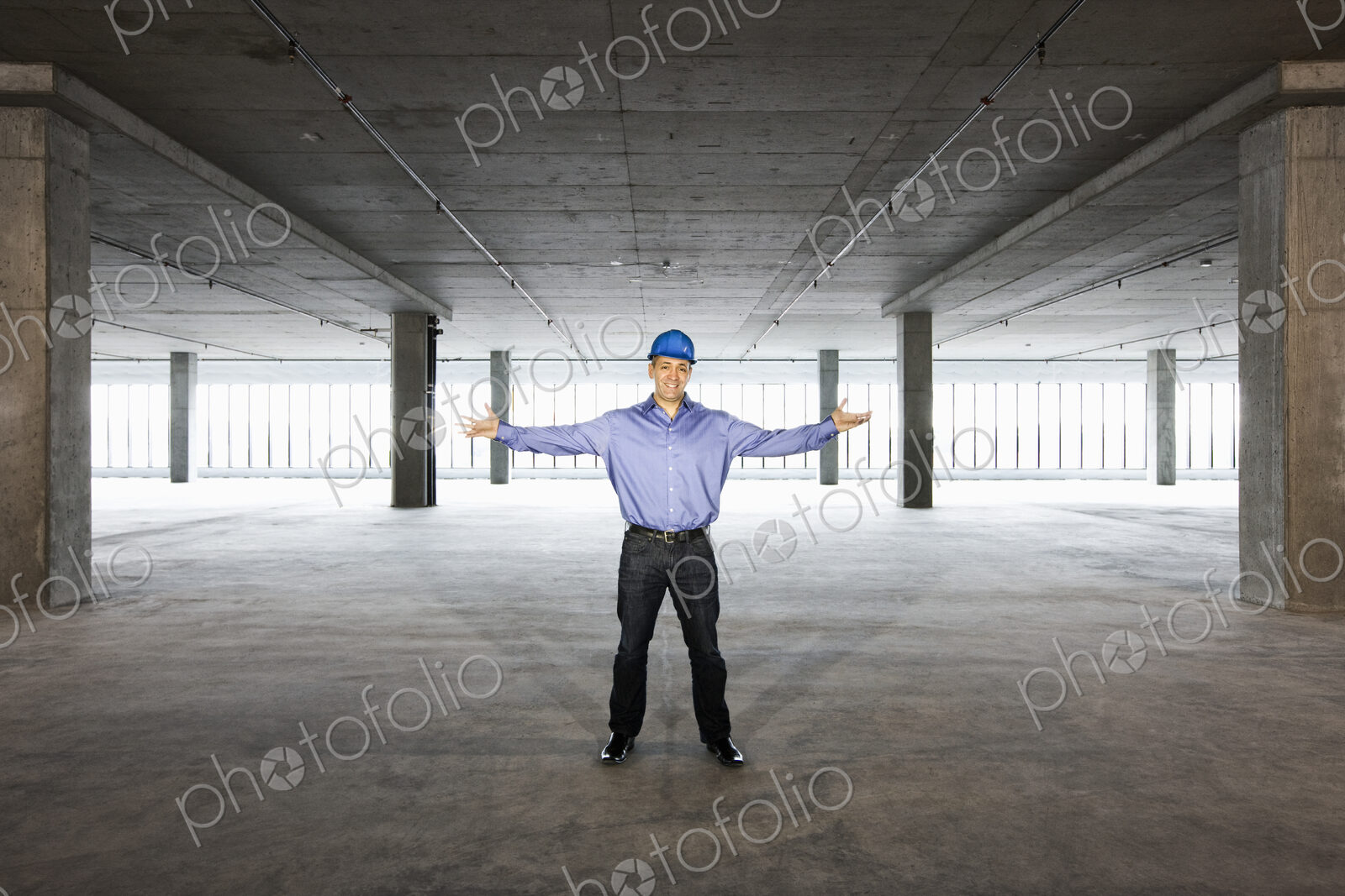 A Caucasian male architect in a new raw business space.