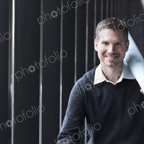 A Caucasian male architect in a new raw business space. A Caucasian male architect in a new raw business space.
