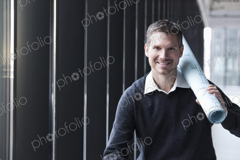 A Caucasian male architect in a new raw business space.
