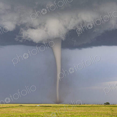 A Condensed Tornado, a rotating column of air reaching to the ground, a defined shape. A Condensed Tornado, a rotating column of air reaching to the ground, a defined shape.