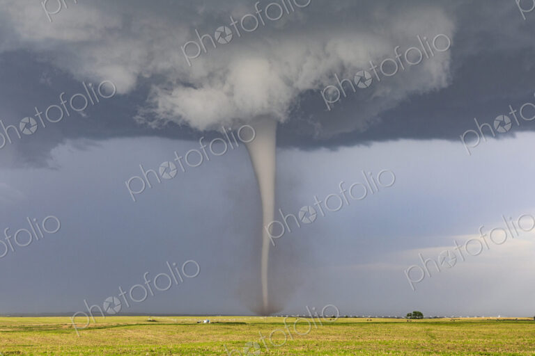 A Condensed Tornado, a rotating column of air reaching to the ground, a defined shape.
