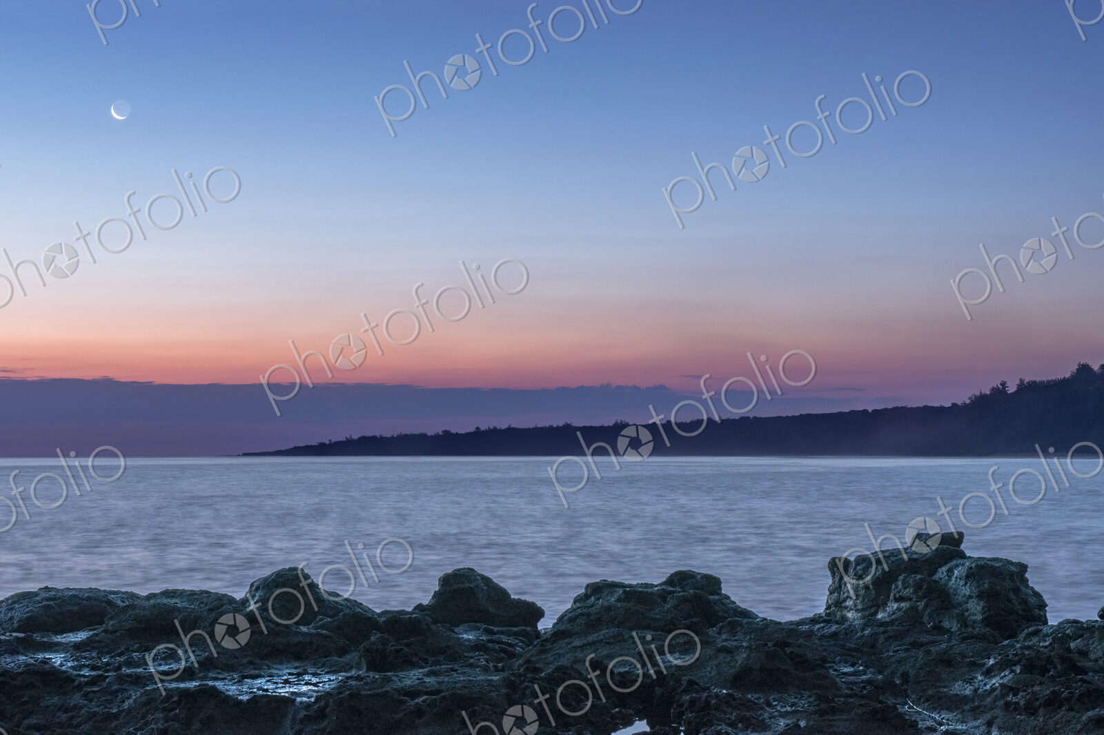 A Crescent Moon in the sky over Mokolea Point.