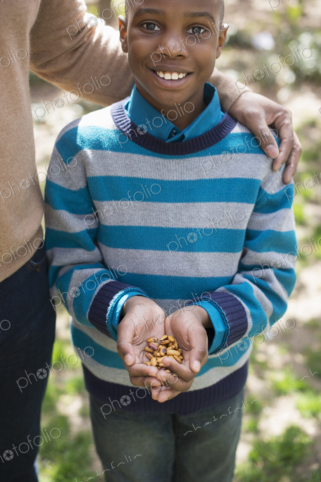A New York city park in the spring. Sunshine and cherry blossom. A mother and son, a…