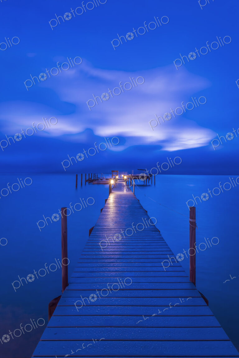 A Private Dock at Dawn, view along the walkway to the lights at the end, stretching…