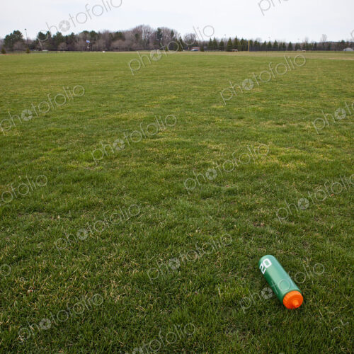 A Water Bottle on a Sports Field