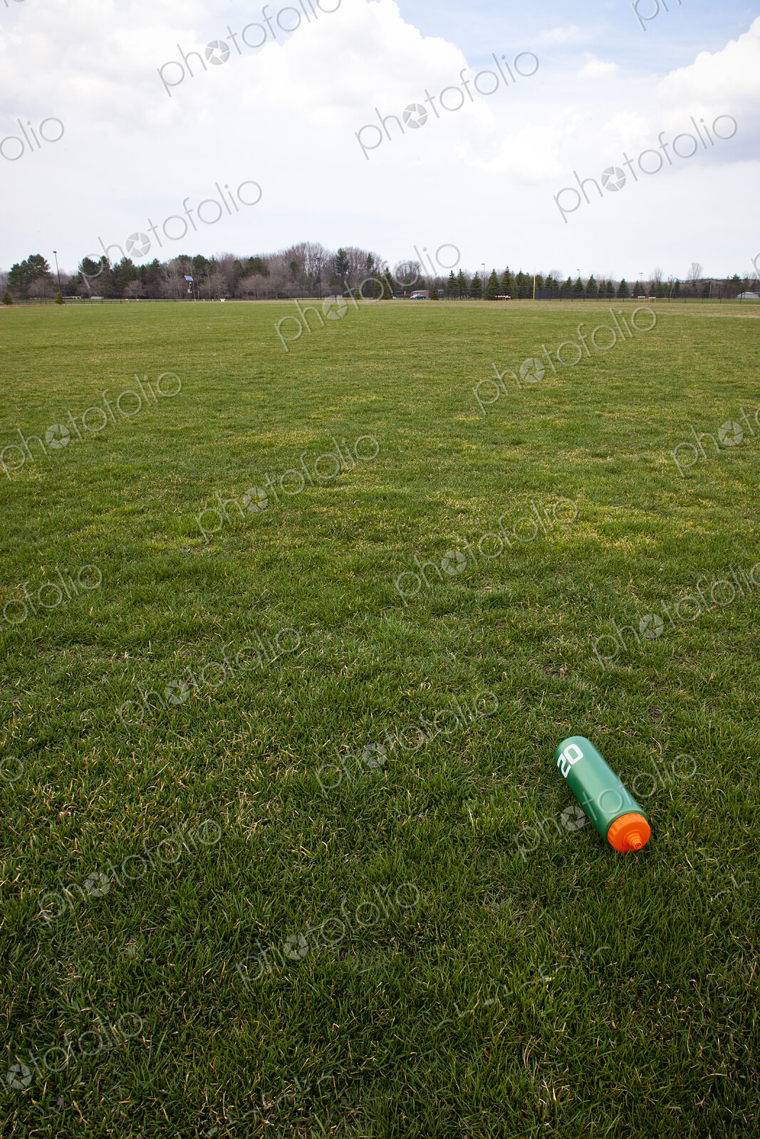 A Water Bottle on a Sports Field