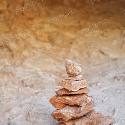 A balanced stack of red and orange sandstone rocks forms a small cairn in Bryce Canyon… A balanced stack of red and orange sandstone rocks forms a small cairn in Bryce Canyon…