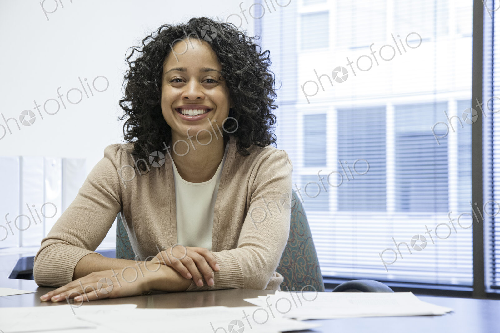 A black businesswoman at her desk in her office.