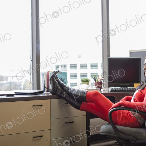 A black office superhero business woman sits in her office and ponders her next… A black office superhero business woman sits in her office and ponders her next…