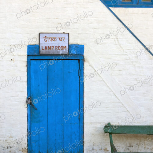 A blue door in a white wall with a sign, Lamp Room, the station of the Kalka-Shimla… A blue door in a white wall with a sign, Lamp Room, the station of the Kalka-Shimla…