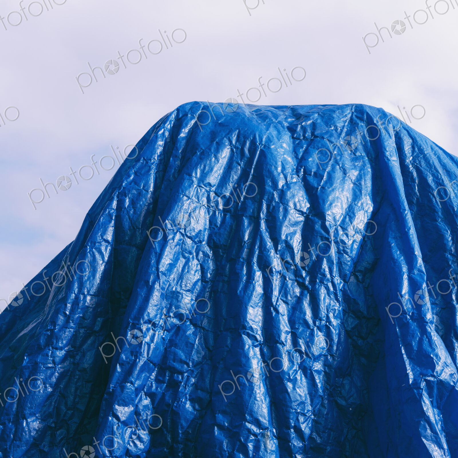 A blue tarpaulin, draped over commercial fishing nets, Fisherman’s Terminal, Seattle