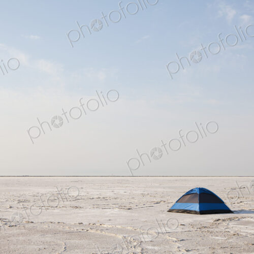 A blue tent on Bonneville Salt Flats at dusk. A blue tent on Bonneville Salt Flats at dusk.