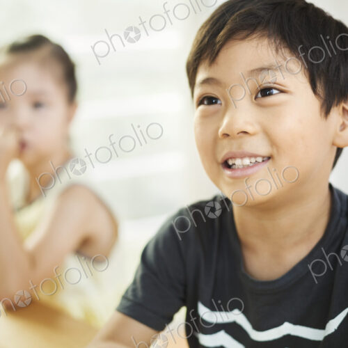 A boy and girl sitting in a classroom.