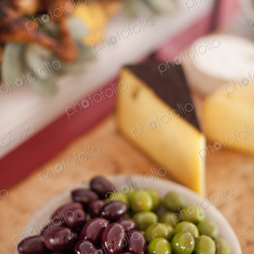 A buffet table laid out for a party. Organic food. A cheese board selection, and a…