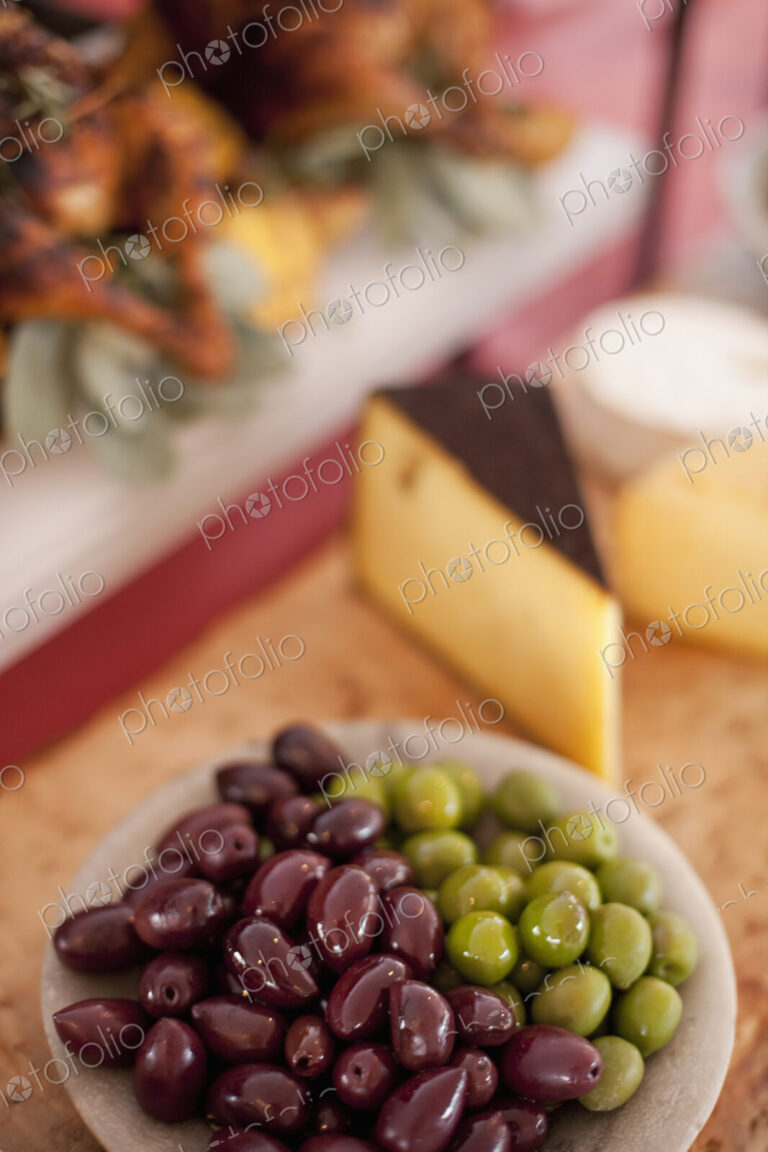 A buffet table laid out for a party. Organic food. A cheese board selection, and a…