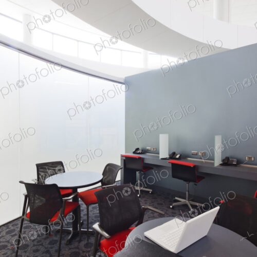 A business centre, tables and chairs, laptops and telephones. A business centre, tables and chairs, laptops and telephones.