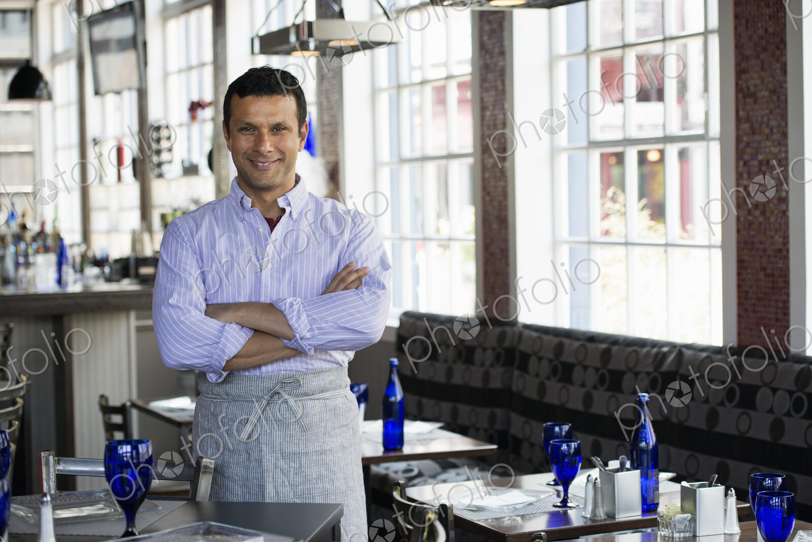 A cafe interior. A man in chef’s whites.