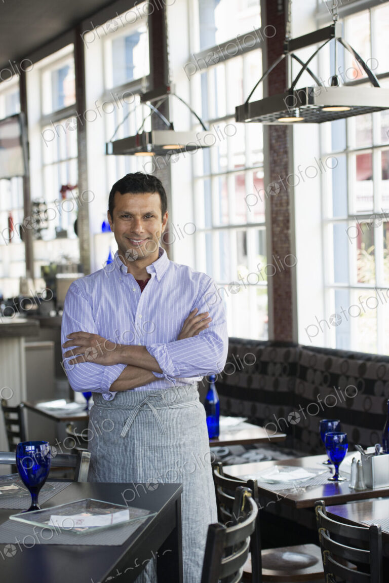 A cafe interior. A man in chef's whites.