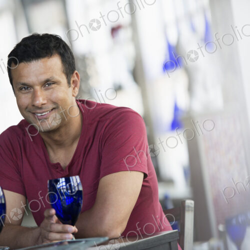 A cafe interior. A man sitting at a table. A cafe interior. A man sitting at a table.
